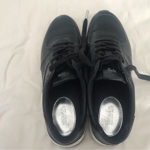 Womens Michael Kors leather sneakers.